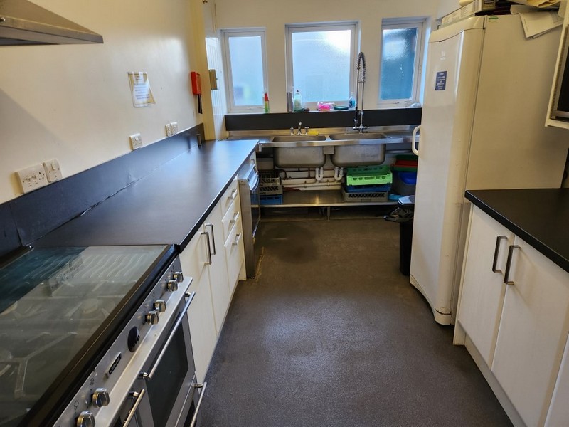 The well equipped village hall kitchen is accessed from the reading room.