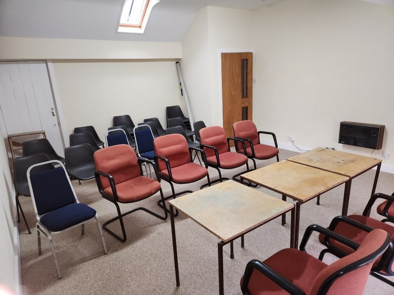 The upstairs meeting room with seating for up to twenty five persons