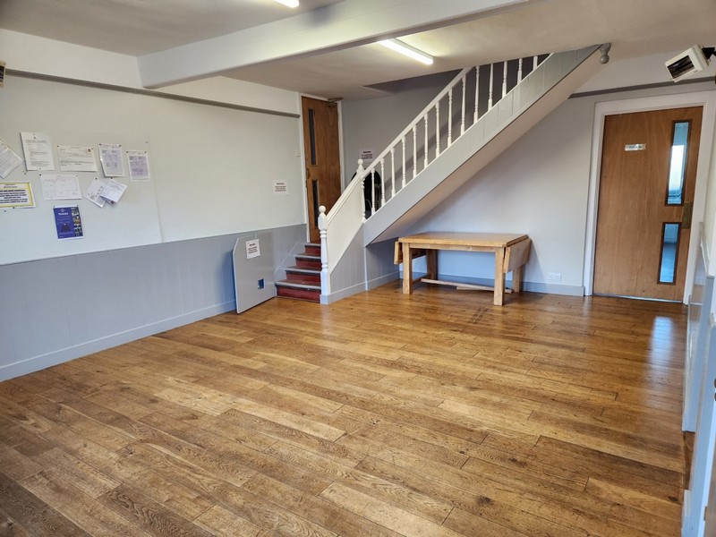 The reading room is located between the Main hall and the kitchen