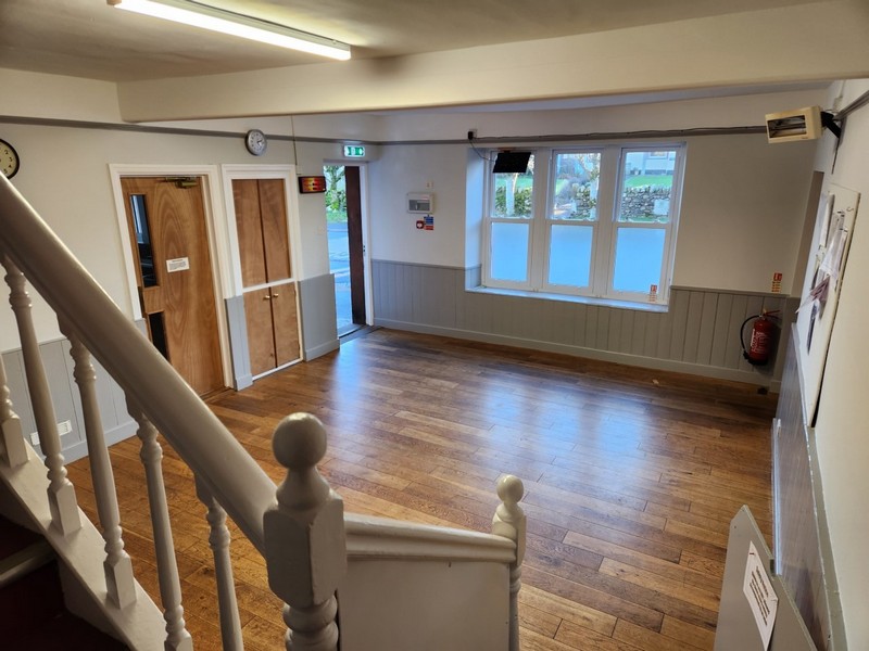 The reading room is located between the Main hall and the kitchen